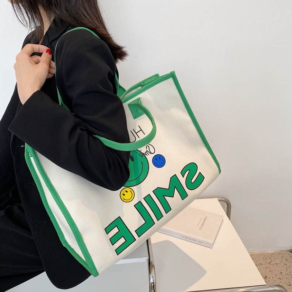 

designer bags dongdamen south korea spring and summer 2022 new smiling face cartoon printing messenger student canvas tote female