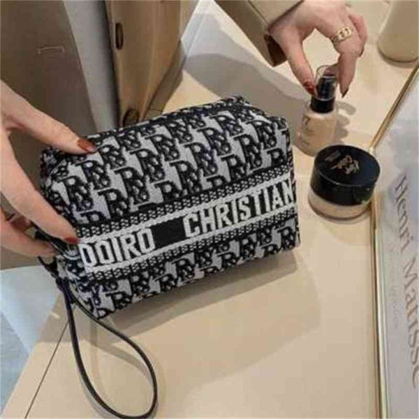 

super low discount fog flower versatile letter foreign style hand large capacity cosmetic bag