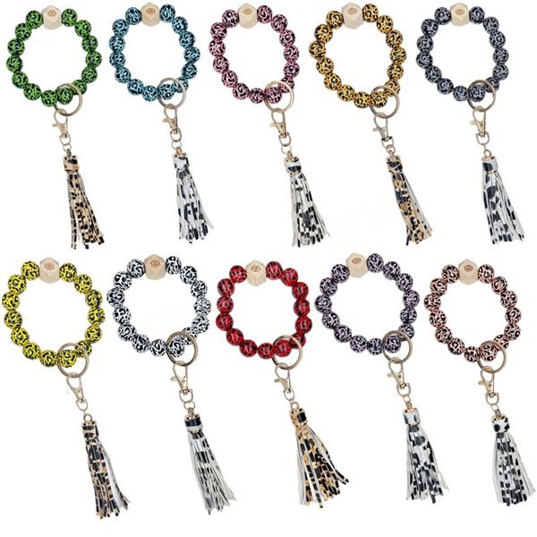 Braccialetti di perline di legno Portachiavi con stampa leopardata Gioielli fatti a mano Ciondolo con nappa in pelle Ciondolo con cinturino alla moda Braccialetti con anello da polso