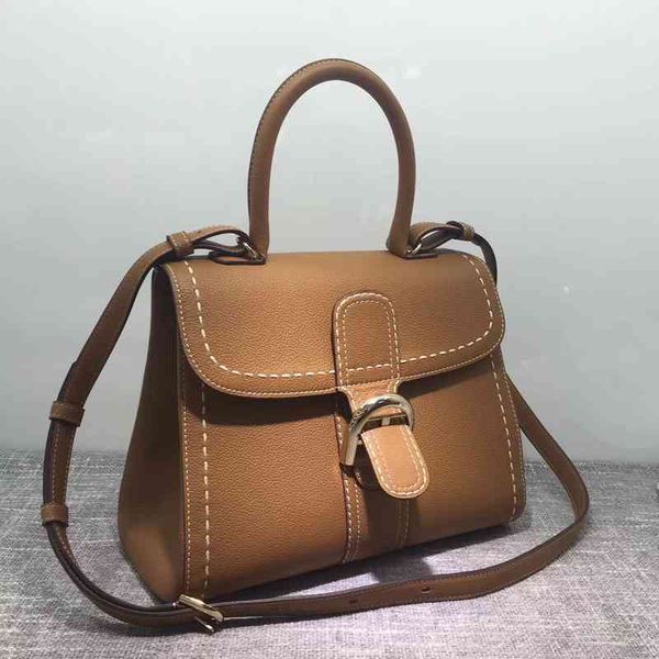 

wendelwalds bags maocao delvo bag litchi pattern hand sewn white thread horseshoe buckle togo cow leather women caramel color