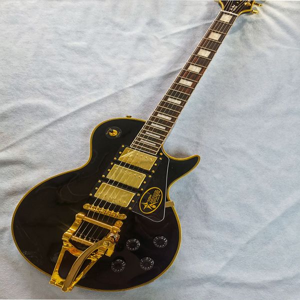 

black 6-string electric guitar with vibrato good feel good sound quality postage customizable