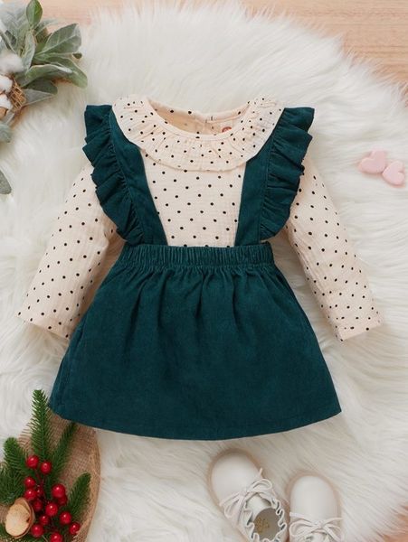 

little girl poka dot shirt and suspender skirt she, White