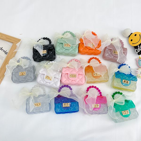 Ins Baby Girl Jelly Transparent Bow Pearl Bolsas Doce Crianças Color Matching Chain Cross-Body Bag Trendy Crianças Um Ombro Bolsas Zero Carteiras F1290