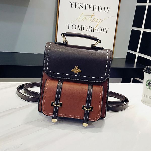 

designer bag british backpack with metal decoration and contrast leather 23cm