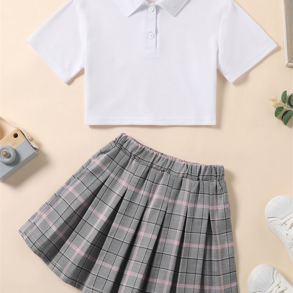 

little girl polo neck t-shirt and plaid pleated skirt she, White