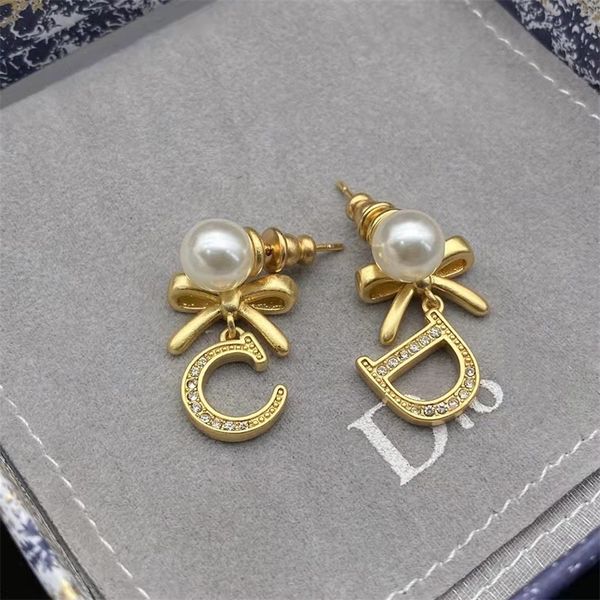 

80% off outlets 21 year new bow asymmetric pearl earrings letter earrings female, Golden