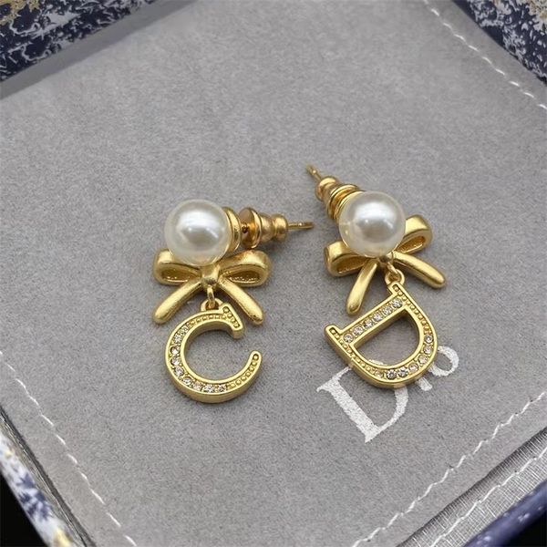 

80% off online store 21 year new bow asymmetric pearl earrings letter earrings female, Golden