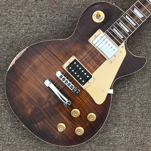 

relic electric guitar, one piece of neck and body, rosewood fingerboard, chrome hardware, flame maple tune-o-matic bridge, solid mahogany g