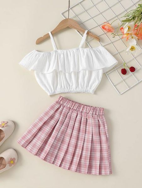 

little girl's shoulder cut blouse and plaid pleated skirt she, White
