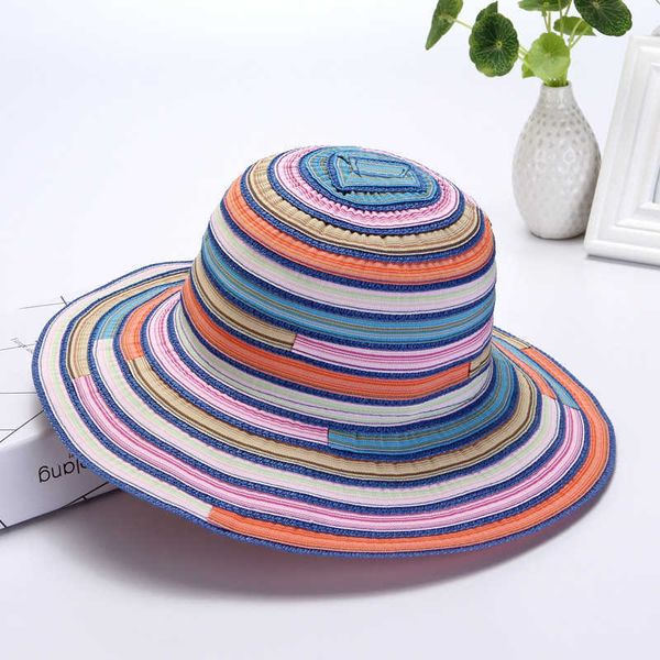 Fischer weiblich Sommer faltbare Sonnenhut Regenbogen gestreiften Stoff bunte Sonnencreme Frau Strandurlaub idyllische Casual Cap