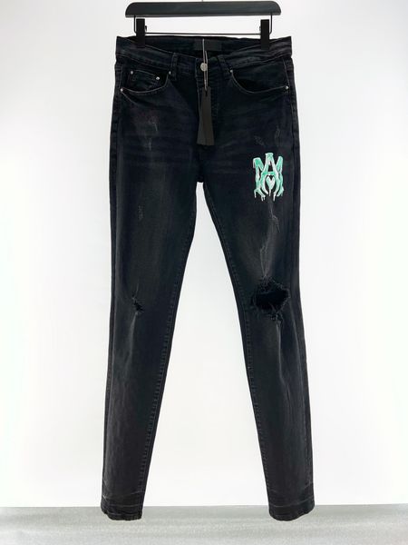 MONS Designer Jeans Fashion Hole Skinny Version calça lápis Design de impressão de alta qualidade Homem de luxo jeans de motocicleta preta