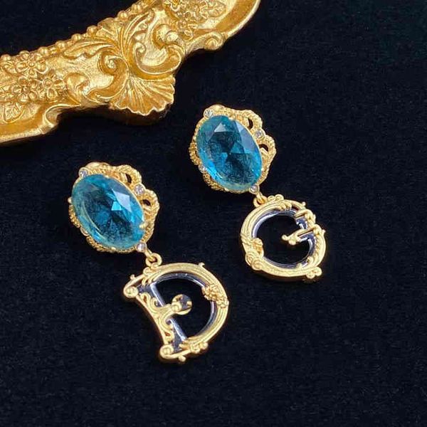 

letter inlaid with large blue rhinestone cool wind brass 925 silver needle female ornament jewelry sale, Golden
