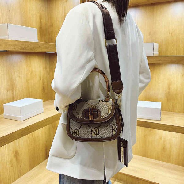 

fashion trend new ladies luxury brand designer bag wholesale saddle 2022 one shoulder diagonal handbag leisure net red canvas women's
