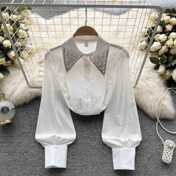 

women's blouses & shirts 2022 spring design sense heavy industry hand beaded long sleeved white shirt women's french loose and ver