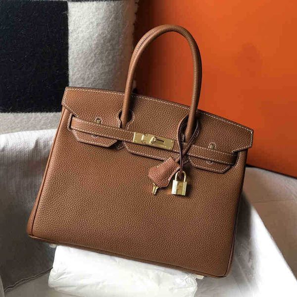 

layer litchi cattle leather bag new temperament handbag have