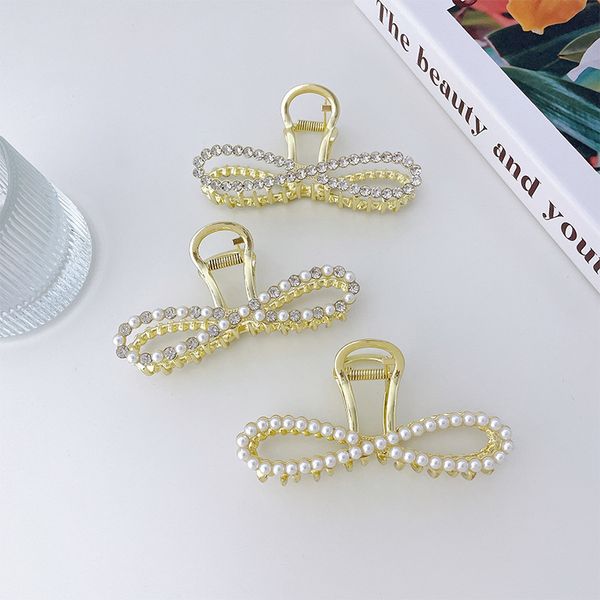 

yamog women bow-tie pearl crystal hair clamps hollow out 8 shape metal hair claw clips european female large size shower ponytail scrunchies, Slivery;golden