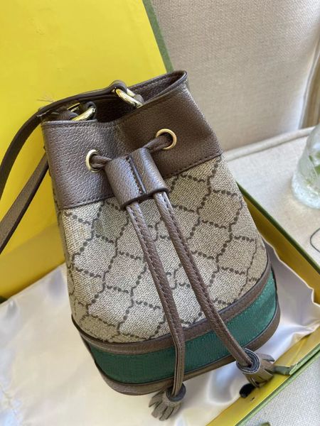 

designer designed mini diagonal bag. color bar decoration, bucket shape.