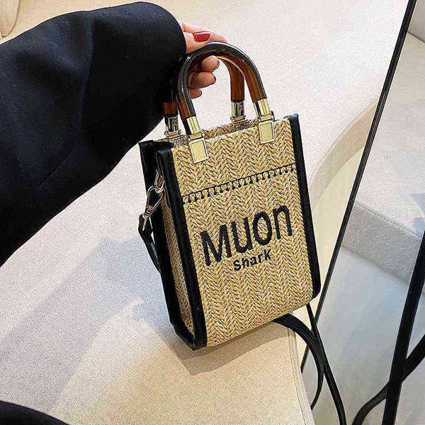 

factory direct sale straw female 2022 new fashion summer niche design portable woven net red messenger small bag