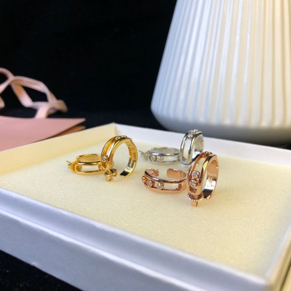 

designer women's studs gold move simple luxury stud diamond earrings, Golden;silver