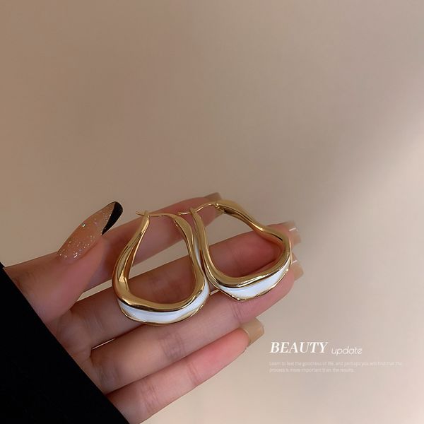 

irregular geometric ear clip metal twisted surface design earrings for women korean ins cold style graceful earrings, Golden
