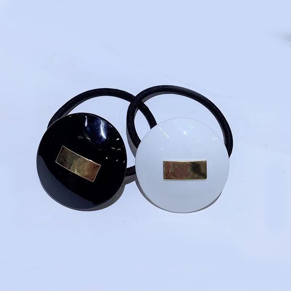 Moda semplice in bianco e nero acrilico rotondo in metallo elastico testa corda capelli anello forcine popolari copricapo gioielli nei paesi europei e americani