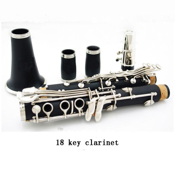 

18-key, pockmarked , nickel-plated bb clarinet, 18k black tube