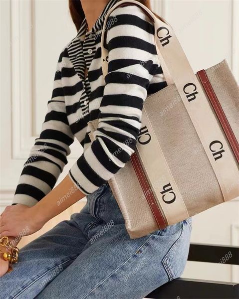 Borse da donna all'ingrosso WOODY Tote Shopping Mano Tela di alta qualità Designer di lusso Moda Lino Grande spiaggia Borsa da viaggio a tracolla con tracollaE