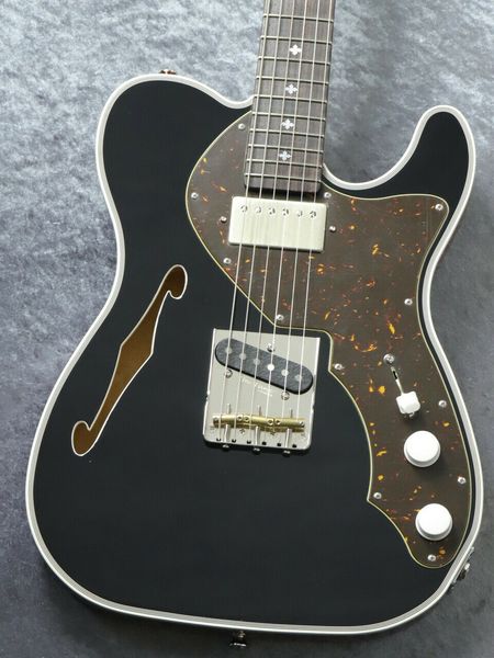 

psychederhythm: hollow-t line solid black electric guitar