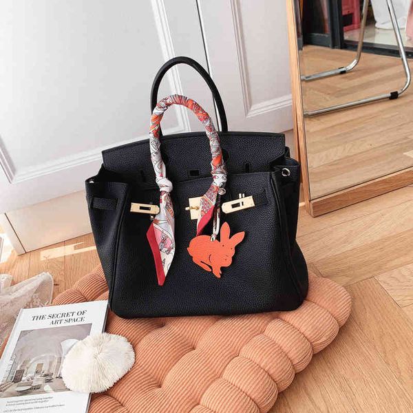 

30 35cm miss shu / junset sign soft waxy leather yuan version leather layer cowhide women's large capacity handbag platinum bag