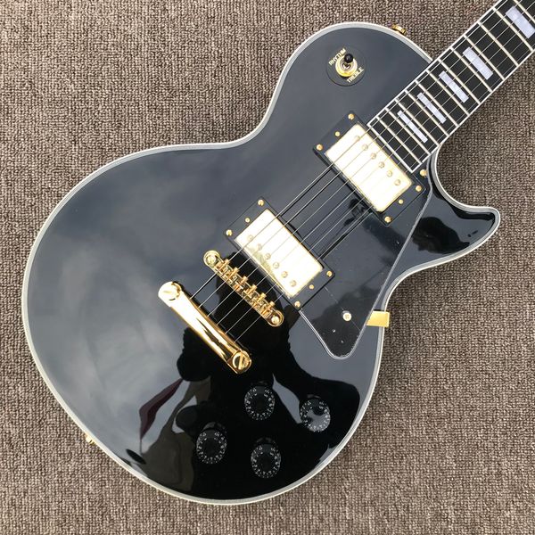 

custom lp electric guitar, gold hardware, 2 pickups, ebony fingerboard, frets binding, black solid mahogany body guitar