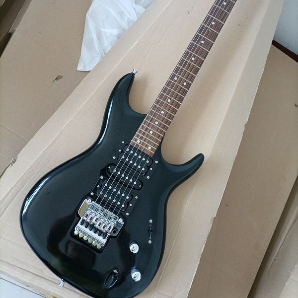 

6 strings black electric guitar with tremolo bar 24 frets