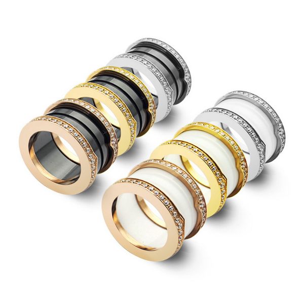 Anello stile Europa America Uomo Donna Donna Acciaio inossidabile con lettera incisa Bordi intarsiati Diamanti Tour-band in ceramica bianca nera Amanti dell'oro 18k Anelli larghi