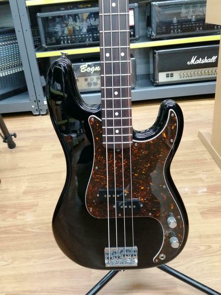 

the standard precision bass electric guitar is consistent with picture