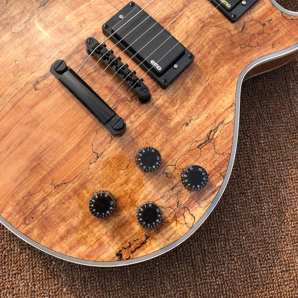 

electric guitar,decaying wood,rosewood fingerboard,black hardware