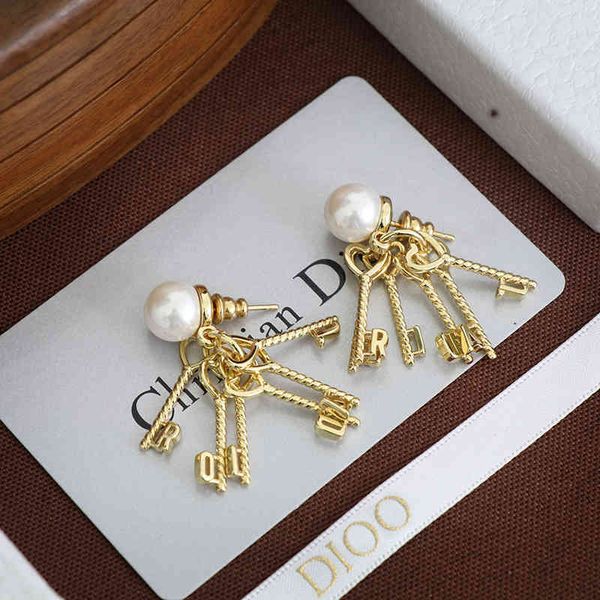 

2022 factory wholesale new dijia pearl key hanging light gold personalized female earrings, Golden