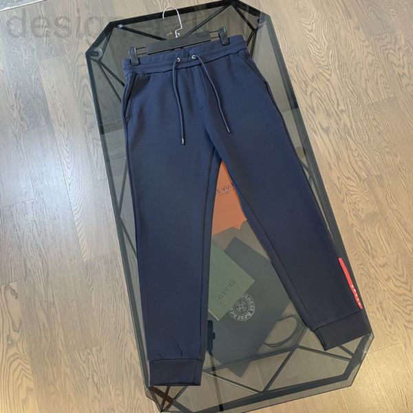 

men's pants designer pujia 2022 spring and summer new couple's triangle red bar adhesive pressing leisure pants men's women&#, Black