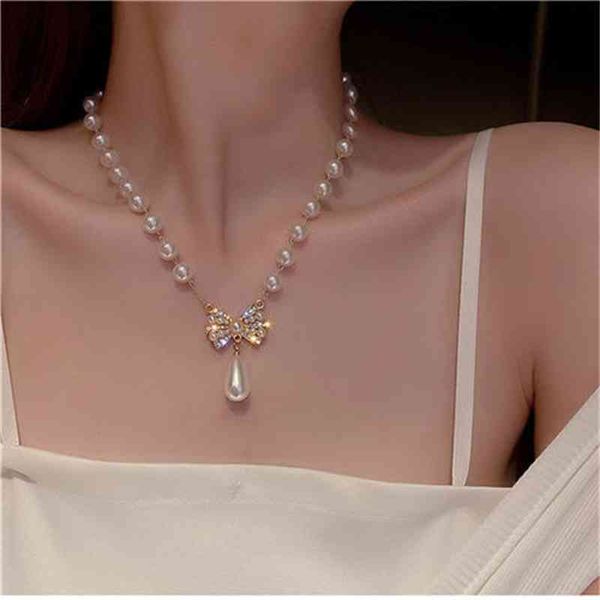 

designer gold silver heart love cross necklace mens womans bowknot pendant pearl necklace new womens luxury niche design clavicle advanced s