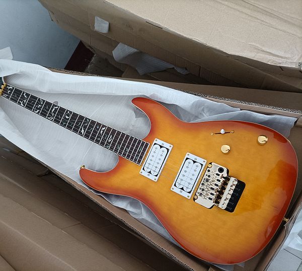 

6 strings orange electric guitar with quilted maple veneer rosewood fretboard
