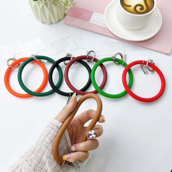 Pulvetiva de silicone redonda Strantas de pulseira de pulso Keychain esportes ao ar livre Acessórios criativos de capa anti-telefones para Apple iPhone Xiaomi Samsung Vivo Oppo