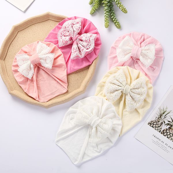 Baby Cotton Turban Caps Kleinkindjunge Mädchen Mädchen Spitzen Stickbögen Kopfschläuche Motorhaube Neugeborene Mützen Kinder Foto Requisiten Kopfbedeckung