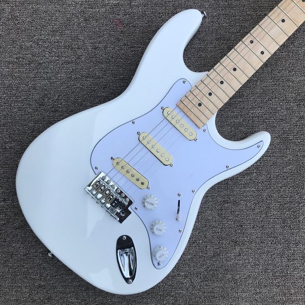 

st electric guitar, maple fingerboard, 3 pickups, chrome hardware, vibrato system, white guitar