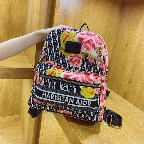 

30% off 2022 new trendy handbags explosive models graffiti canvas broken flower student schoolbag leisure version men's and universal b