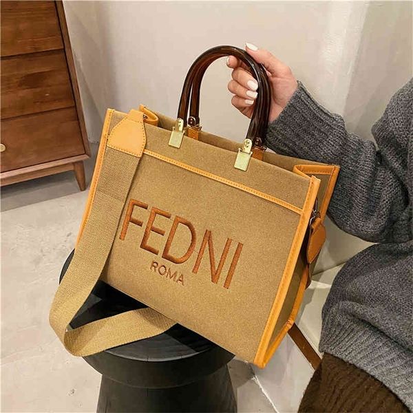 Bolsas baratas 70% de desconto em coreano Simple Mulher Feminino 2022 Nova moda Saco de ombro versátil Bag de lona portátil de grande capacidade