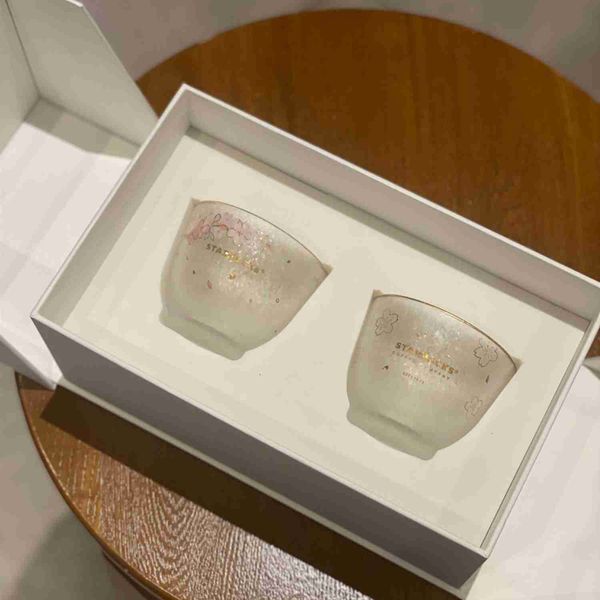 

starbucks cherry blossom cup in spring 2022 cherry blossoms are in full bloom, gold painted glass pair cup lovers are a pair of gift boxes