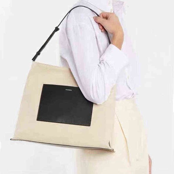

spring and summer simple beige niche brand sander canvas medium women's shoulder bag large capacity temperament