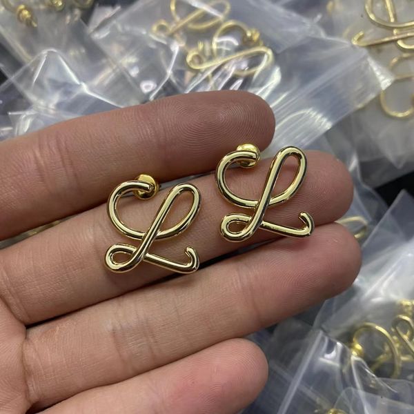 

2022 new rowe family 1.1 high version ruyi knot earrings women's fashion simple design light gold hollow, Golden