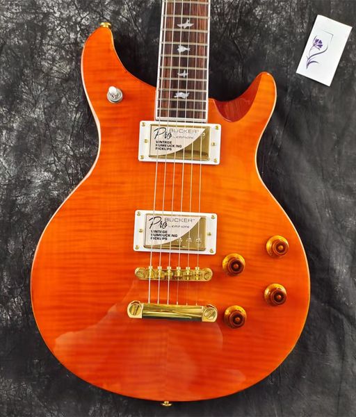 

electric guitar, orange tiger stripe, custom pickups, you get what you see
