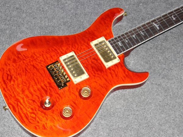 

electric guitar body mahogany orange quilted maple tremolo bridge, gold hardware