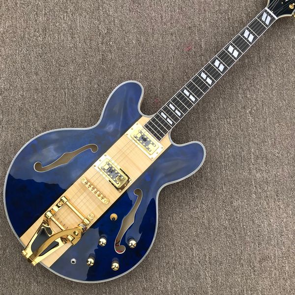 

jazz hollow body electric guitar, rosewood fingerboard, gold hardware, 2 f holes, tremolo system as same of the pictures