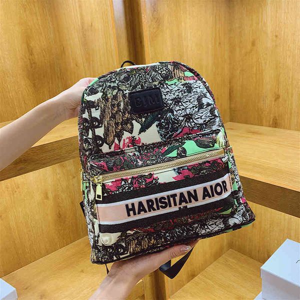 

2022 new designer handbags graffiti canvas broken flower student schoolbag leisure version trendy men's and universal backpack